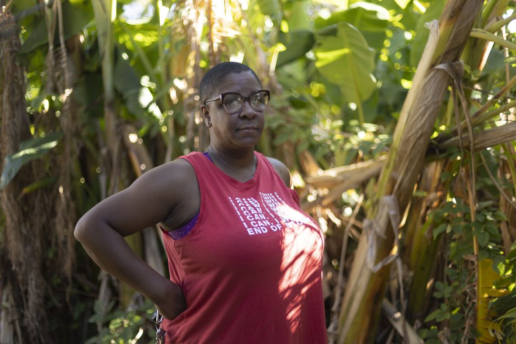 Dee Dee Green, leader of Hollygrove Neighbors Association, stands tall in Hollygrove Community Garden.