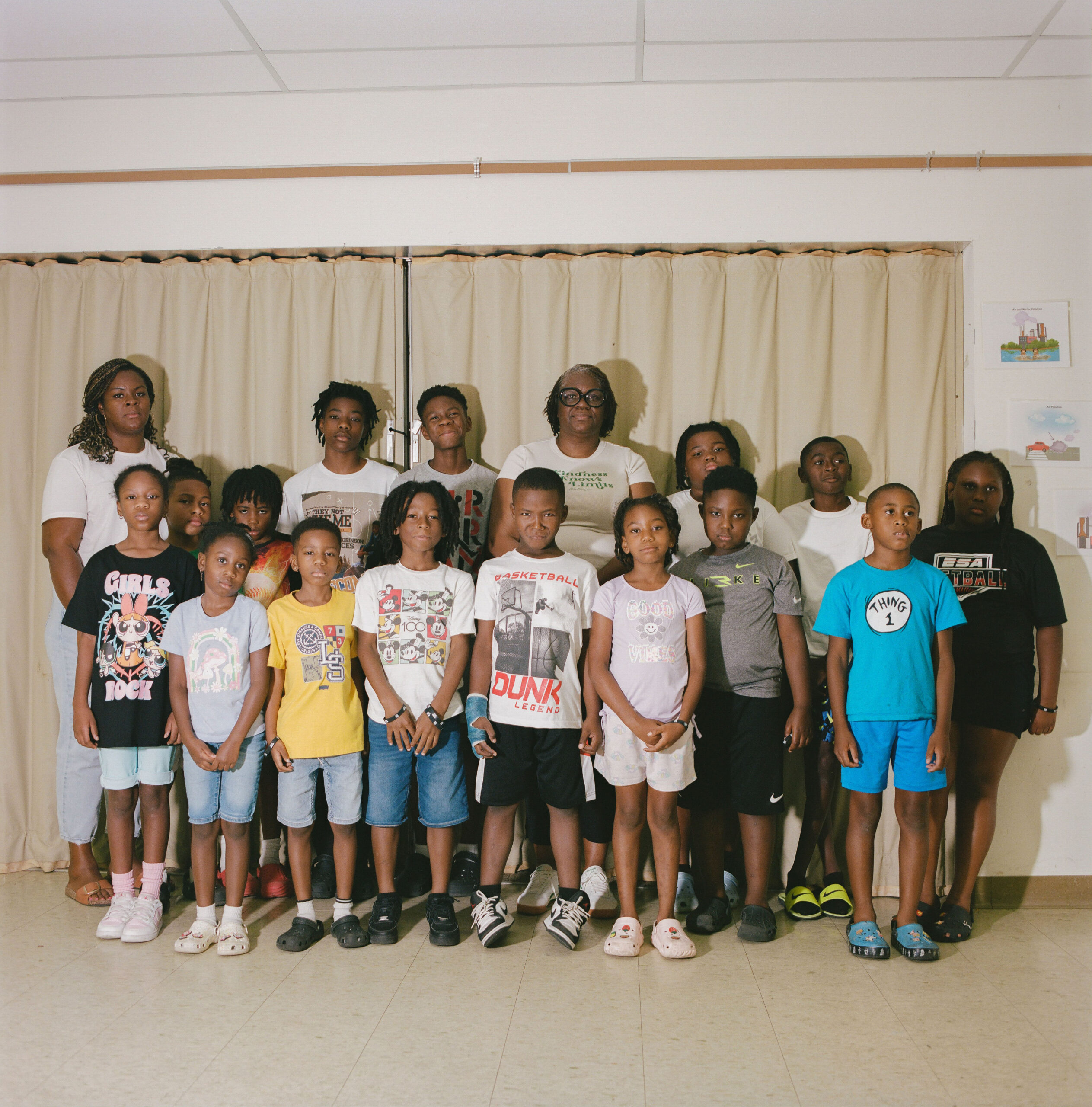 Dr. Krystal Nicole Martin, founder and CEO of KMartin Group stands with youth in Gloster.