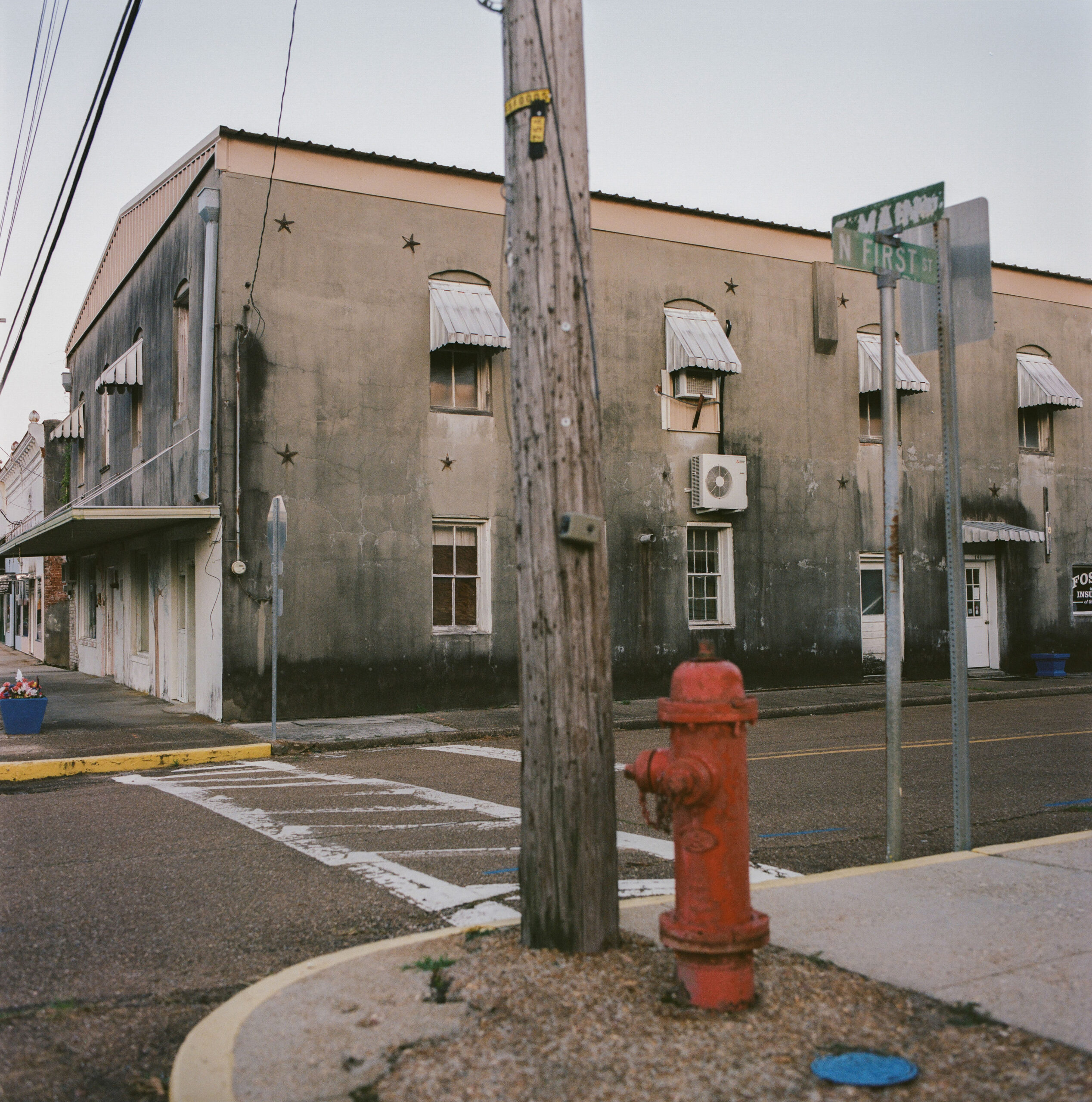 An abandoned building on Gloster’s Center Street, once a bustling shop, now stands empty—a quiet reminder of the town’s economic decline.