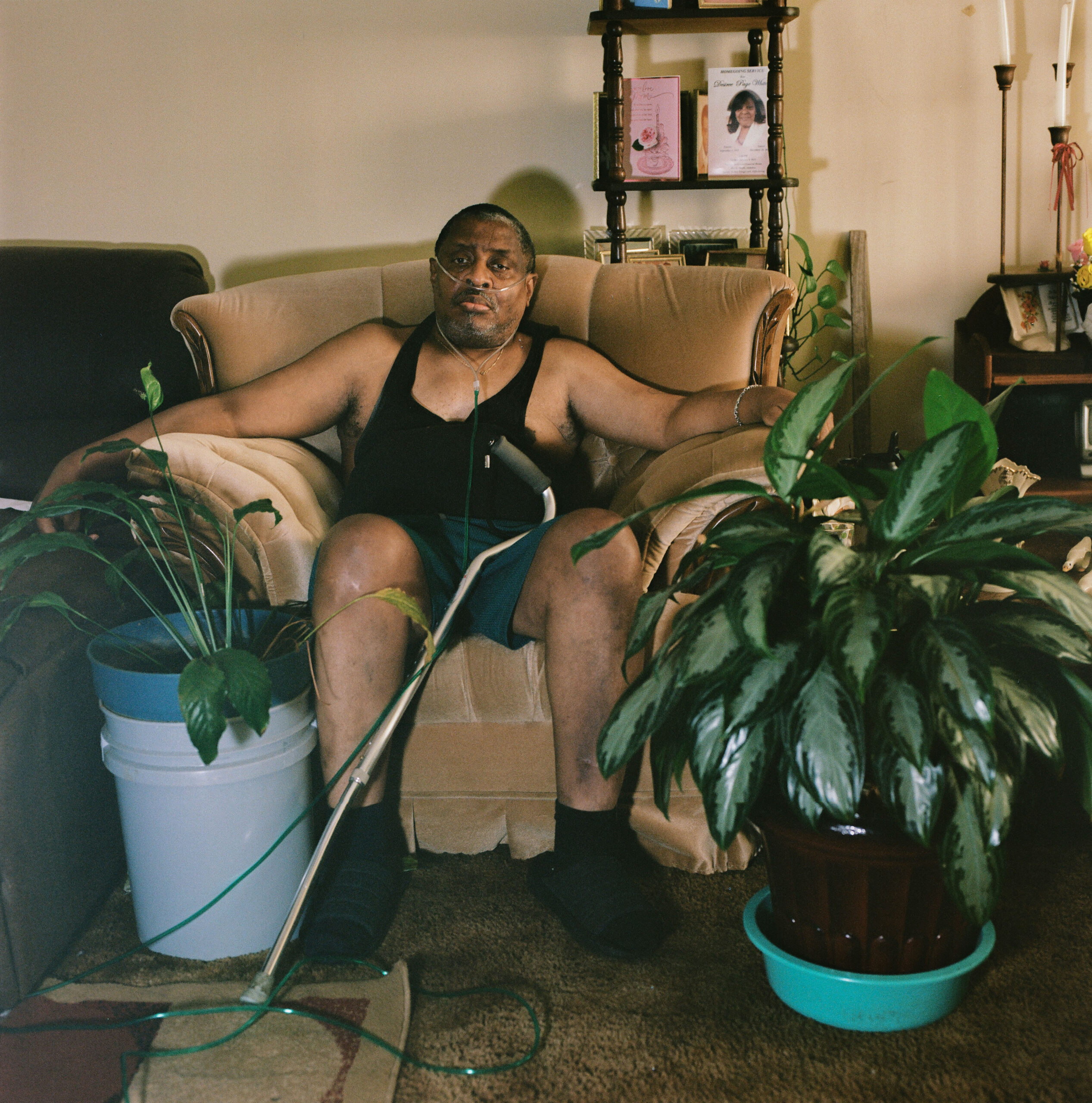 Curtis Harris, 60, born in Chicago and a former English teacher, moved to Gloster four years ago to live with his mother. Since relocating, he has struggled with breathing issues, fatigue, and declining health. He now requires three different treatments each month, which have become increasingly difficult to afford.