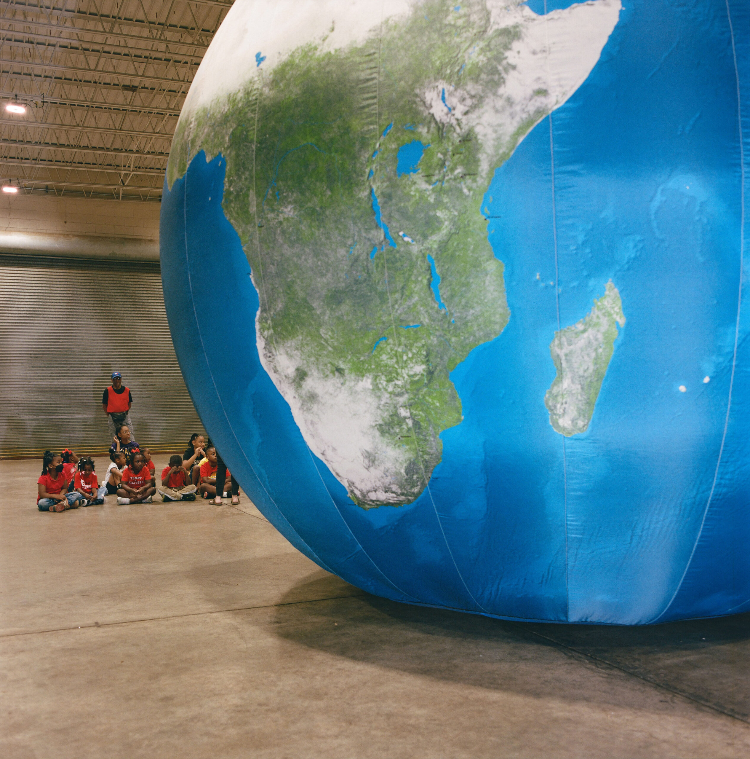 Big Plastic Globe event hosted by Drax Amite in Gloster, aiming to teach kids about the globe, geography and pollution.