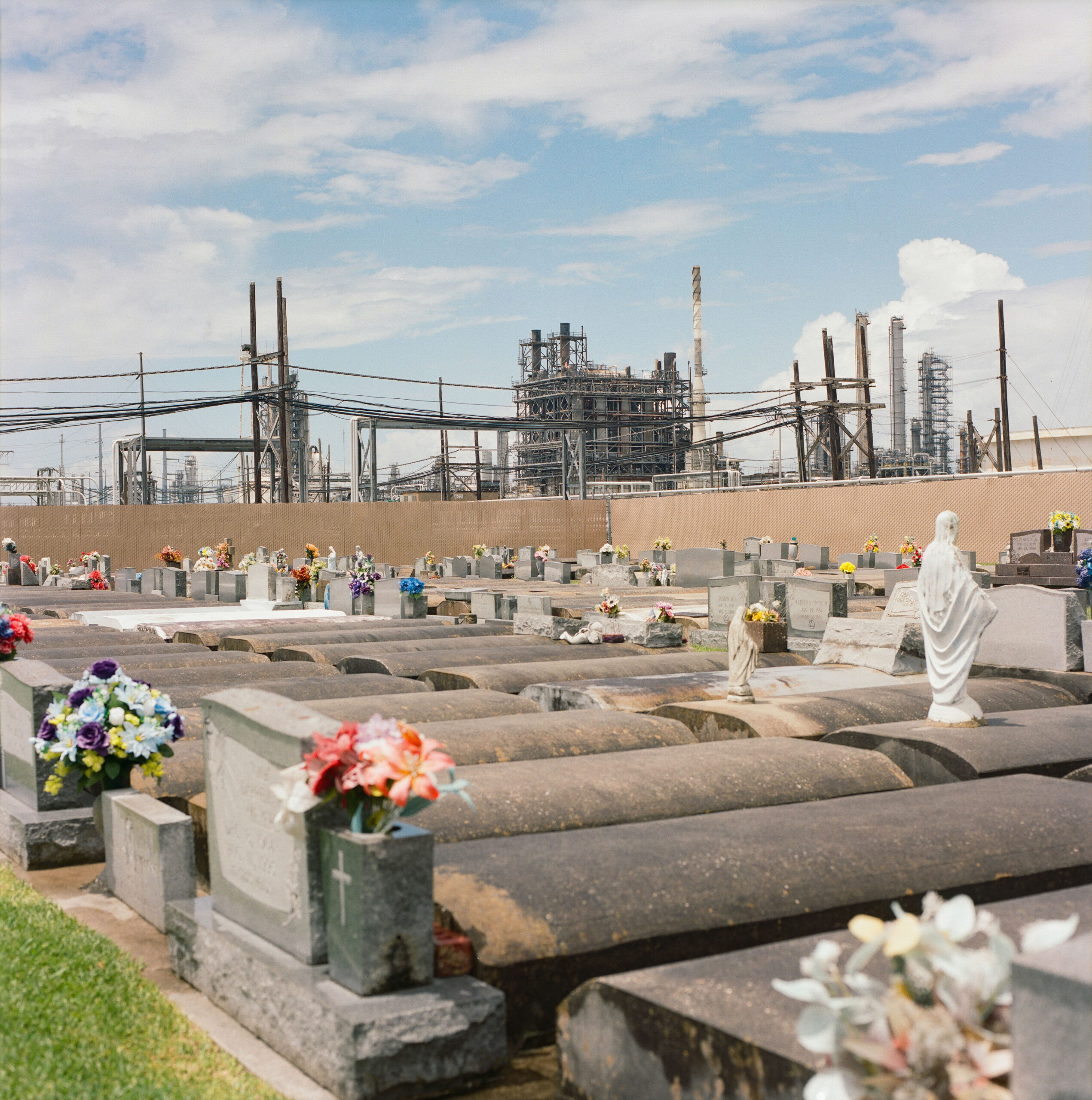 Holy Rosary Cemetery rises amid the ruins of New Orleans’ industrial district—a testament to faith and endurance in a once-thriving hub. Its ornate tombs honor Catholic immigrant families who built the city, even as nearby communities face new injustices.