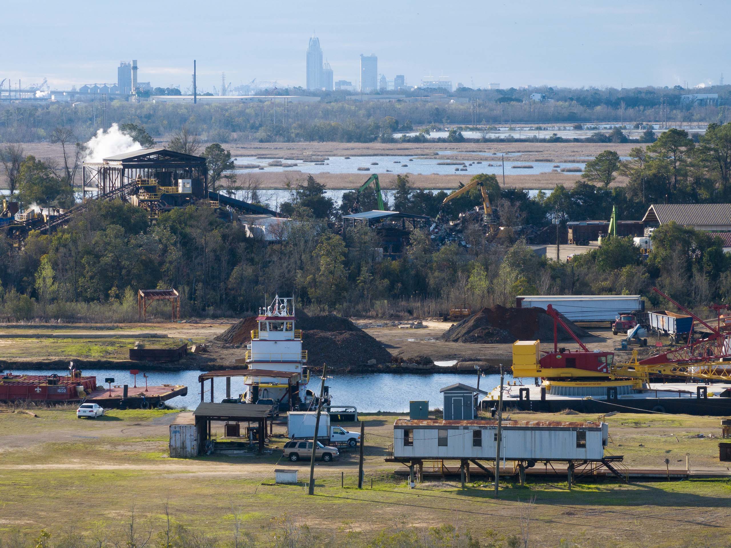 Industrial facilities with Mobile in the background.