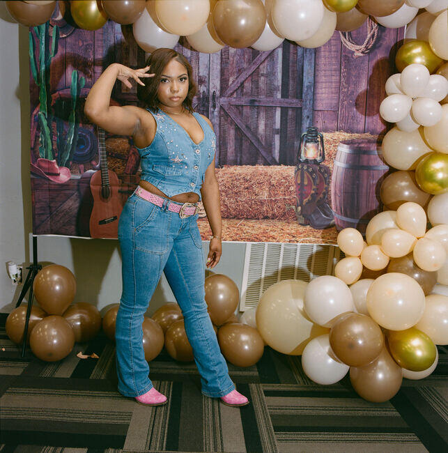 A young woman, Donyae, at a Mother's Day celebration party at North Oak Plaza.