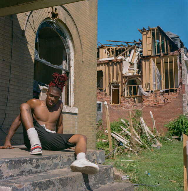 A local young boy’s house demolished during the storm and he squat in the next house, which he thinks is relatively better to live in for a while.