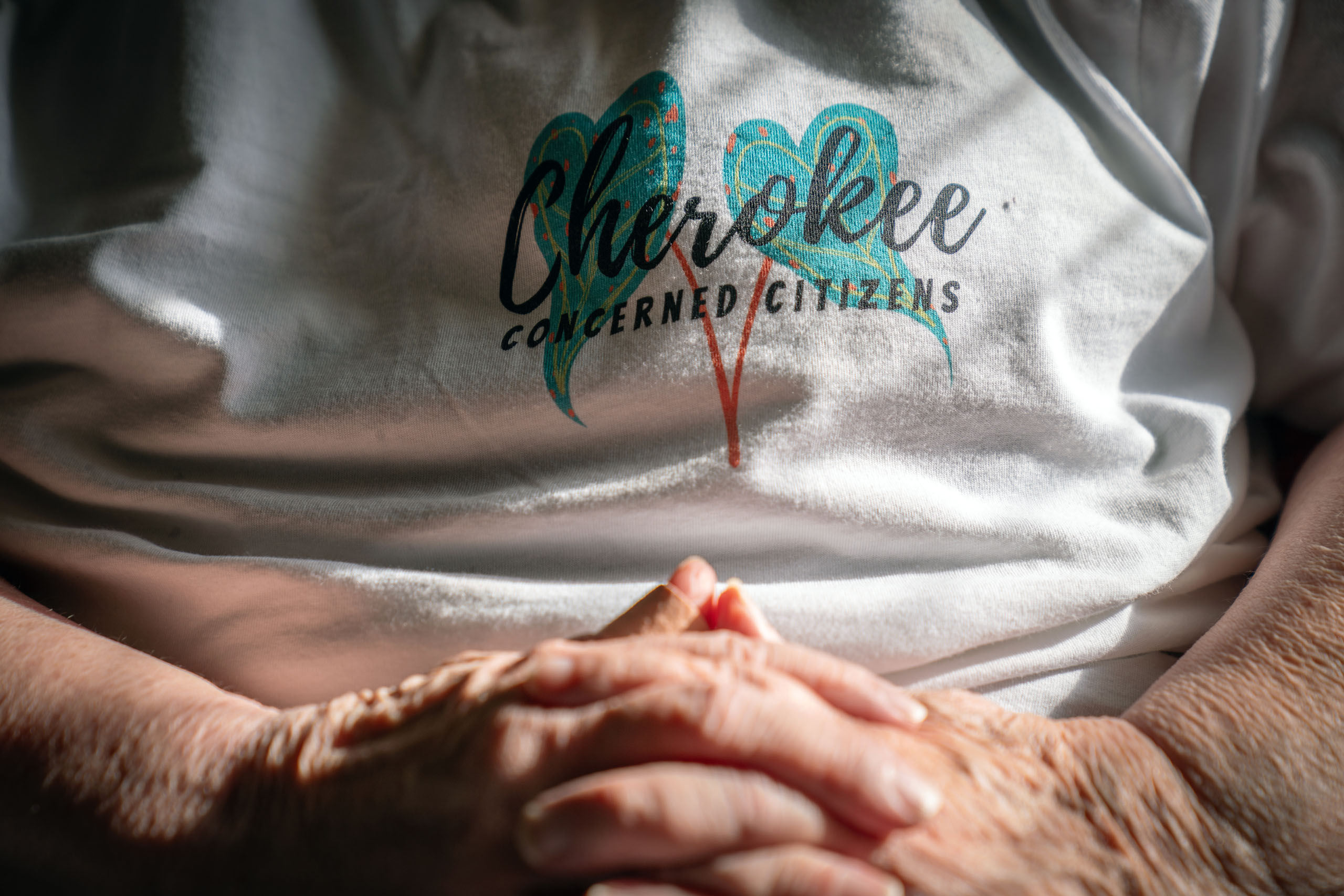 Barbara Weckesser wears a shirt for her organization, the Cherokee Concerned Citizens.